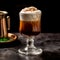 Irish Coffee cocktail with whipped cream, brewed coffee and Irish whiskey
