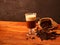 Irish coffee in glass on wooden table. Alcoholic or non-alcoholic