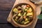 Irish dinner. Beef meat stewed with potatoes, carrots and soda bread on wooden background, top view, copy space. Homemade winter