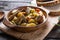 Irish dinner. Beef meat stewed with potatoes, carrots and soda bread on wooden background, top view, copy space. Homemade winter