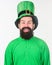 Irish eyes are smiling. Irish man with beard wearing green. Bearded man celebrating saint patricks day. Hipster in