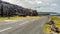 Irish landscape along â€‹â€‹the Burren with the rural coastal R477 road and the sea in the background