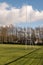 Irish National sport tall goal post on a training ground. Camogie, hurling, rugby, gaelic football pitch. Warm sunny day, Cloudy