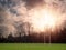 Irish National sports training pitch with goal posts for Gaelic sports camogie, hurling, Irish football, rugby and soccer. Sunset