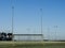 Irish sport training ground with tall goal posts for camogie, Gaelic football and rugby on a cold winter day. Frost on the green