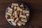 IRIVNE, CALIFORNIA - 26 JAN 2020: A group of branded wine corks in a bowl from domestic and foreign wineries