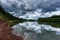 Irkut river with a quiet current and clouds reflection, Eastern Siberia, Russia