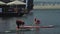 Irkutsk, Russia - August 3 2019: Baikal Jet Fest, BJF. Athlete on stand up paddleboard sup holding paddle board up