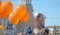 Irkutsk, Russia - May 9, 2015: Young girl on fathers shoulders and orange balloons on Victory Day in Irkutsk