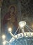 Iron ancient chandelier with on the ceiling the Virgin and Christ child in a monastery in Armenia.