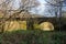 Iron bridge over a river in nature with arches and scrub