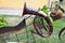 Iron brown musical trumpet, a pipe for playing music on a background of green grass