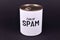 Iron can with white label saying `Can of Spam`