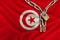 Iron chain and lock on the silk national flag of Tunisia with beautiful folds, the concept of a ban on tourism, political