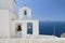 Iron church bells on a chapel roof on the romantic volcanic island of Santorini Greece popular European holiday destination