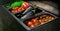 Iron containers in the kitchen with vegetables