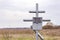 Iron crosses on an old abandoned grave in the steppe on a spring day