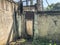 Iron garage doors. Rusty door. Stone wall. Close up shot