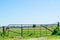 Iron gate in dutch polder landscape