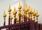 Iron gate with weathered golden decoration.