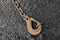 Iron hoist tool hook load heavy lifting weight sling mechanism chain fixed on concrete structure