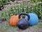 Iron kettlebel, slam ball and pumpkin in backyard