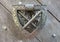 The iron knocker with the family coat of arms of an ancient aristocratic clan on the castle gate