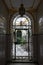 Iron lace on doors and ceramic tiles with ornament at the entrance to traditional patio yards in Andalusia, Spain