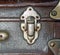 Iron latch of old suitcase as a background