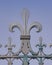 Iron made fleur de lis symbol on a fence