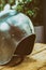 Iron medieval helmet round closeup vertical photo stands on a wooden table