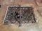 Iron metal grate on opening in stone floor