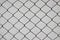 Iron net and white cement wall