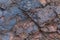 Iron ore texture close up - natural minerals in the mine. Stone texture of open pit. Extraction of minerals for heavy