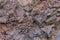 Iron ore texture closeup - natural minerals in the mine. Stone texture of open pit. Extraction of minerals for heavy