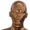 Iron portrait of golden man face stylized. Humanoid robot head iron