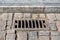 Iron rectangular grating manhole drainage system on the pavement road.