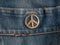 Iron sign of a pacifist on denim