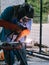 Iron soldering, Man working on iron soldering, welding sparks