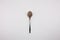 Iron spoon with cocoa powder on a white background