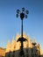 Iron streetlights in front of milan Cathedral