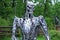Iron Terminator cyborg in Bucha city park. Innovated park decor and design