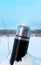 Iron thermos in snow