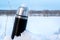 Iron thermos in snow