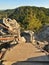 The irony wooden ladder with bended steel handrail in touristic path to viewpoint.