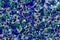 Irregular Glitter Shapes in Shades of Blue and Green Abstract Background