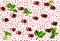 Irregular pattern with sweet cherries and leaves on polka dot background