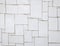 Irregular white tiles on a wall