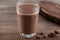 Irresistible Chocolate Milk on a Wooden Table.