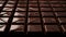 Irresistible chocolate tile mosaic, Close-up view of dark chocolate bar squares.